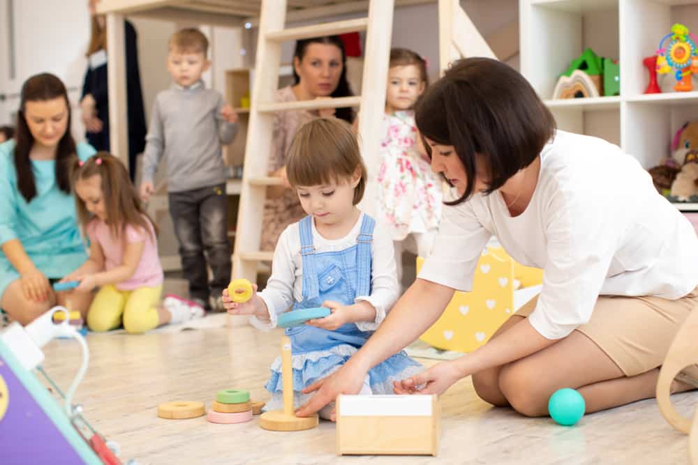 Children Playing In Playroom In Daycare